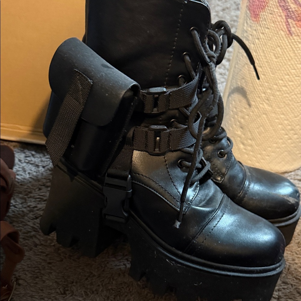 Sleek Black Combat Boots with Utility Pouch